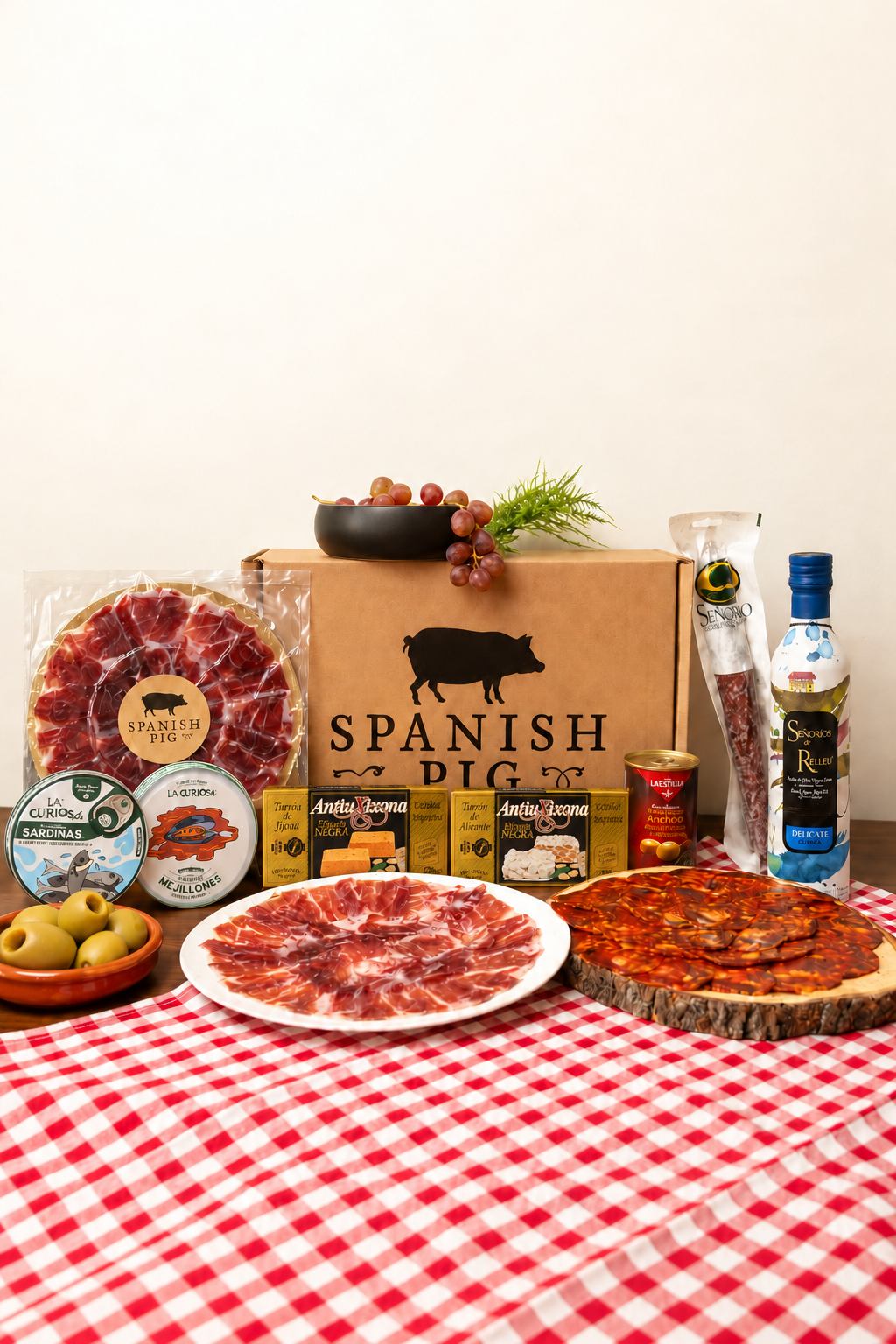 Feast Box with Spanish Pig vacuum-packed Bellota ham, Cebo ham, La Curiosa sardines and mussels, Perelló Gordal olives, AntiuXixona Jijona and Alicante turrón, and Señoríos de Relleu olive oil